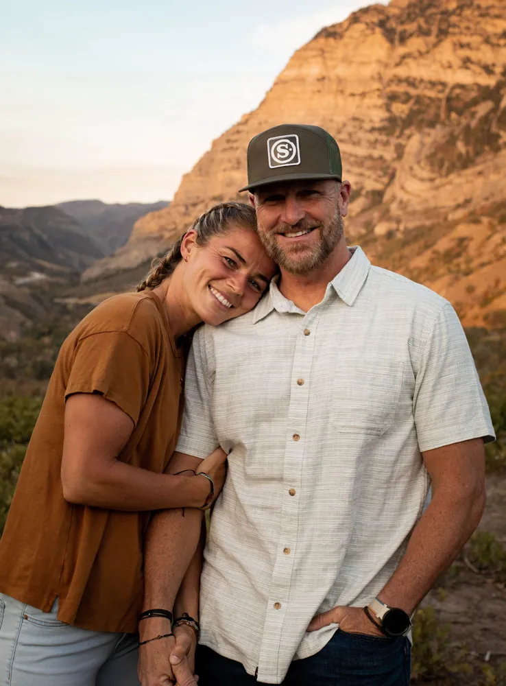 James Lewis and his wife, Kate, in the mountains at sunset